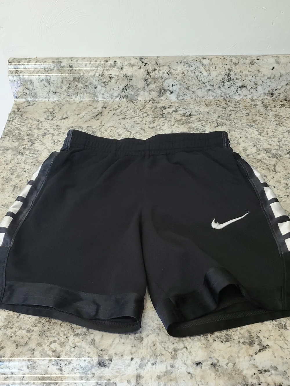 NIKE KIDS Black Athletic Shorts with White Swoosh